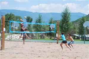 People playing sand volleyball at the center